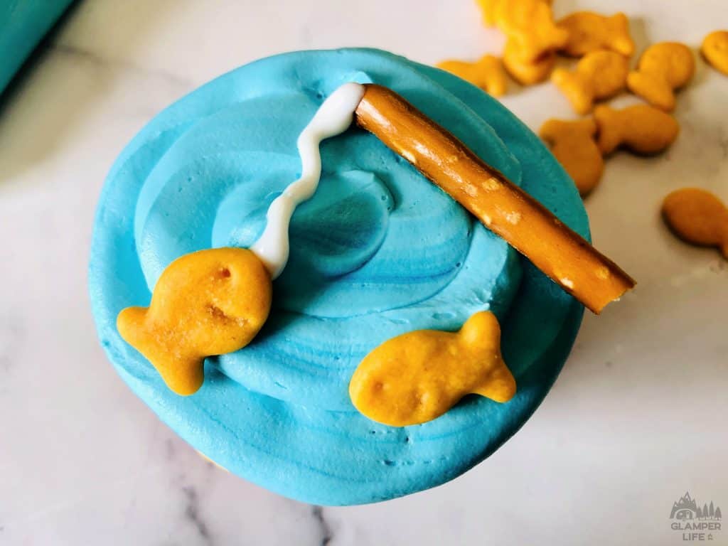 goldfish and pretzel on cupcake