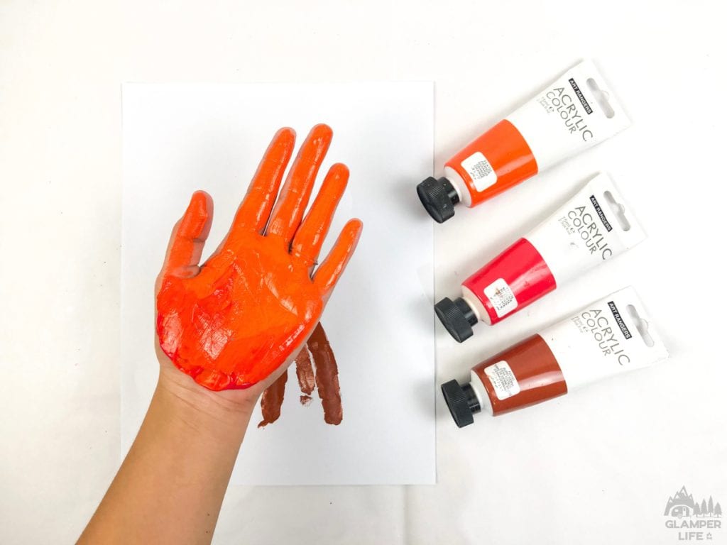 orange and red paint on palm